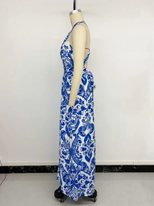Detail of blue baroque floral print and halter backless design on long dress