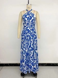Detail of blue and white vintage floral print on a halter neck maxi dress with waistline