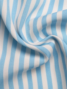 Close-up detail of blue and white striped fabric texture with fine woven pattern