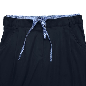 Detail of navy blue high-waist skirt with elastic band and blue-white plaid drawstring