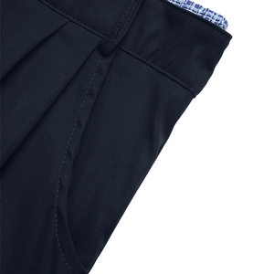 Detail of waist stitching with plaid lining on navy pleated casual trousers