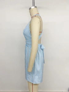 Detail view of the side bow tie and open-back crossover straps on a striped romper