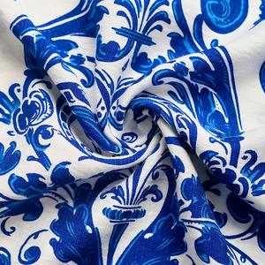 Detail of vintage blue baroque floral print on soft linen-textured halter dress fabric