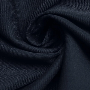Macro shot of high-quality black ribbed knit fabric with soft texture and elastic drape