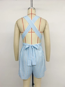 Detailed back view of striped romper with cross-back straps and waist bow decoration