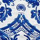 Close-up of vintage blue and white floral porcelain print on a halter backless dress