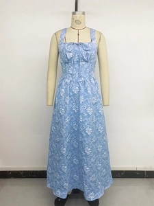 Detail of light blue floral jacquard dress with square neck and bow tie detail