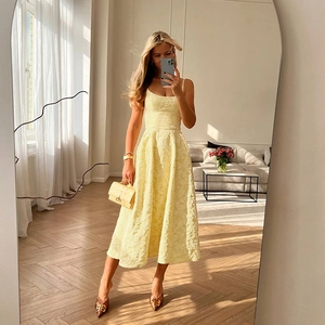 Elegant light yellow floral jacquard midi dress with backless design and A-line silhouette