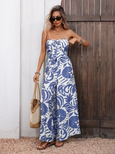Detail of blue and white tropical print strapless jumpsuit with front bow tie decoration