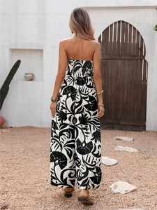 Back view of elegant strapless jumpsuit with black and white tropical floral print