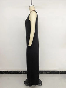 Detail view of large side patch pockets on a black sleeveless wide-leg jumpsuit