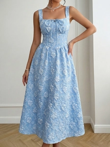 Detailed macro view of light blue jacquard fabric with white floral texture and bow