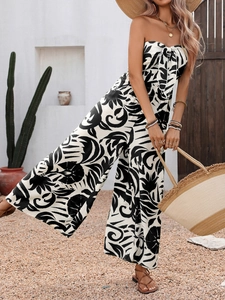 Elegant black and white tropical leaf print strapless crop top and wide leg pants set