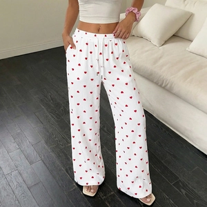 Pantaloni bianchi a vita alta da donna con motivi a cuore rosso e coulisse in vita