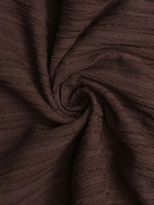 Detailed macro view of chocolate brown ribbed knit fabric with vertical texture and soft drape
