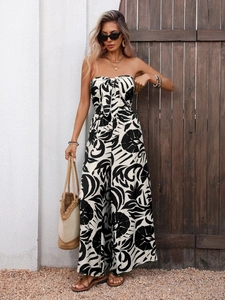 Detail of strapless black and white floral jumpsuit with front tie bow and wide leg cut