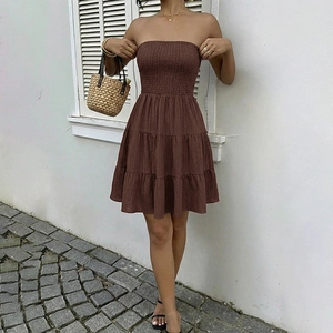 Sleeveless brown smocked tube mini dress with tiered skirt design for summer wear