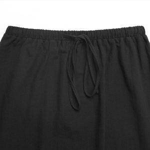 Detailed view of elasticated drawstring waistband on casual black maxi skirt