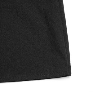 Close-up of high-quality woven fabric texture and neat stitching on a black maxi skirt