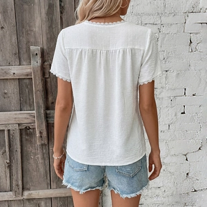 Vintage white lace patchwork blouse with textured fabric and denim shorts back view details