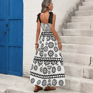 Vintage floral strapless maxi dress with bow straps and boho print in a summer setting