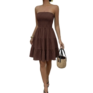 Brown strapless tiered mini dress with smocked bodice and textured summer fabric