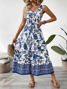 Detailed view of the V-neckline and elegant blue floral print on the summer maxi dress
