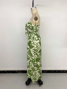 Detail of tropical leaf print strapless jumpsuit with side shirring and front tie knot