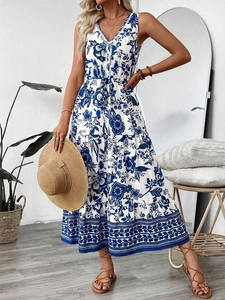 Detail of V-neck sleeveless maxi dress featuring blue floral print and drawstring waist