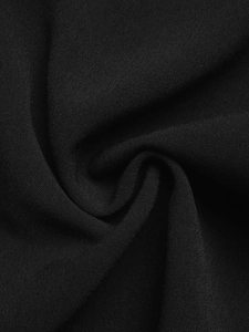 Detailed macro shot of deep black chiffon fabric showing high density weave and soft texture