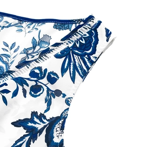 Detail of V-neck sleeveless summer dress with vintage blue floral porcelain print