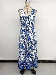 Detail view of boho blue floral print maxi dress with V-neck and tiered skirt design