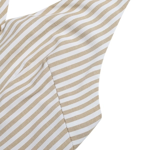 Detailed view of the breathable khaki and white striped fabric texture and seam quality