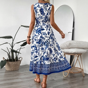 Elegant sleeveless blue and white floral V-neck midi dress for a vintage summer look