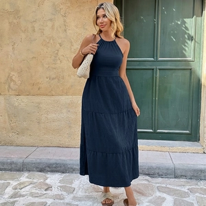 Elegant navy blue halter maxi dress with a tiered skirt and backless design for summer vacation