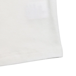 Detail shot of fine knit fabric and neat double-needle hem on a white lace V-neck top