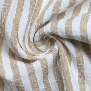 Close-up of khaki and white striped linen fabric texture on halter romper