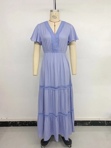Detailed view of the lavender maxi dress featuring delicate lace inserts and tiered layers