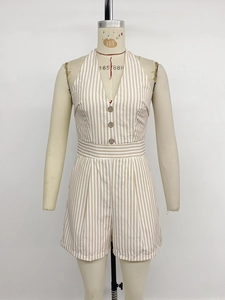 Detail of V-neck halter romper featuring striped pattern and decorative buttons