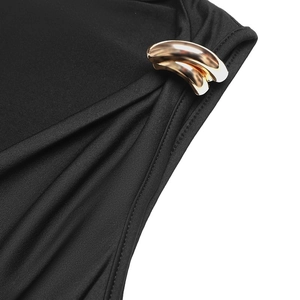 Detail of sleek black v-neck bodysuit with a polished gold metal hardware buckle