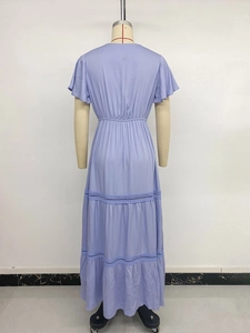 Detailed back view of light purple dress showing tiered skirt and delicate lace trim inserts