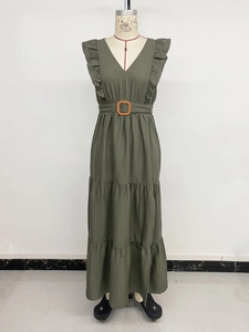 Detail of olive green V-neck dress featuring ruffled shoulders and woven buckle belt