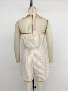 Detail of striped halter romper featuring back neck tie and invisible zipper closure