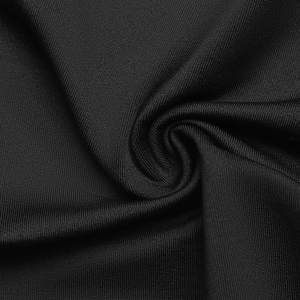 Close-up of black knitted fabric with detailed horizontal texture and soft drape