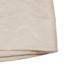 Detail of precise stitching on the champagne fabric hem with high quality knit texture