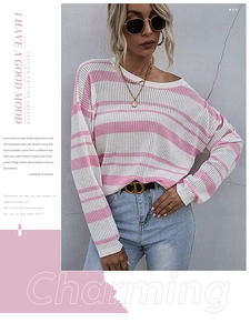 Front view of pink and white striped loose knit sweater with casual denim jeans