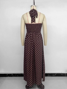 Detail of smocked elastic back and halter neck tie on dark brown polka dot dress