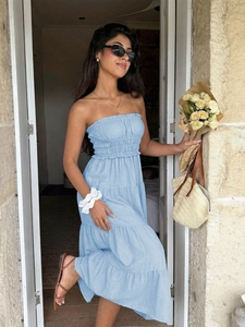 Detail of light blue strapless tiered dress with ruffled layers and smocked bodice design