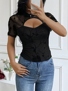 Close-up of black mesh top with mandarin collar, floral lace, and chest cutout detail