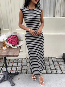Close-up of a slim fit striped knitted sleeveless long dress with high elastic fabric